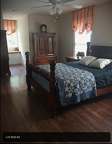 a bedroom with a bed and window