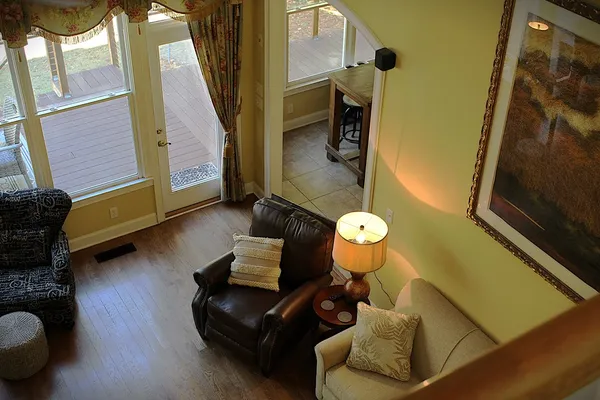 a living room with furniture and a fireplace