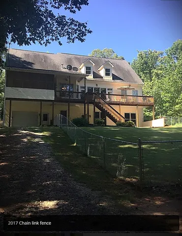 a view of house with yard