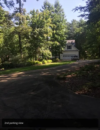 a view of a house and a yard