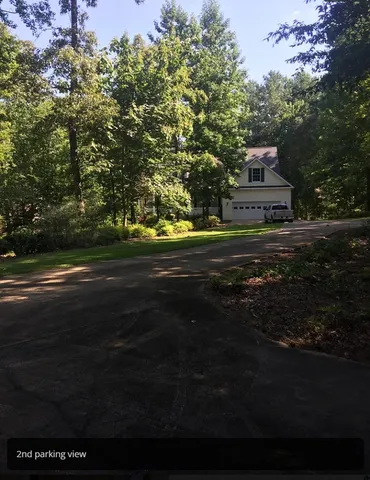 a view of a house and a yard