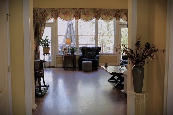 a living room with furniture and a window