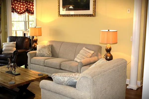 a living room with furniture and a window