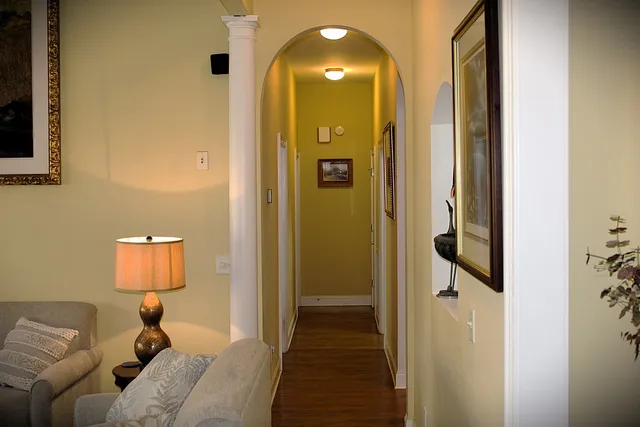 a bedroom with a bed and a mirror