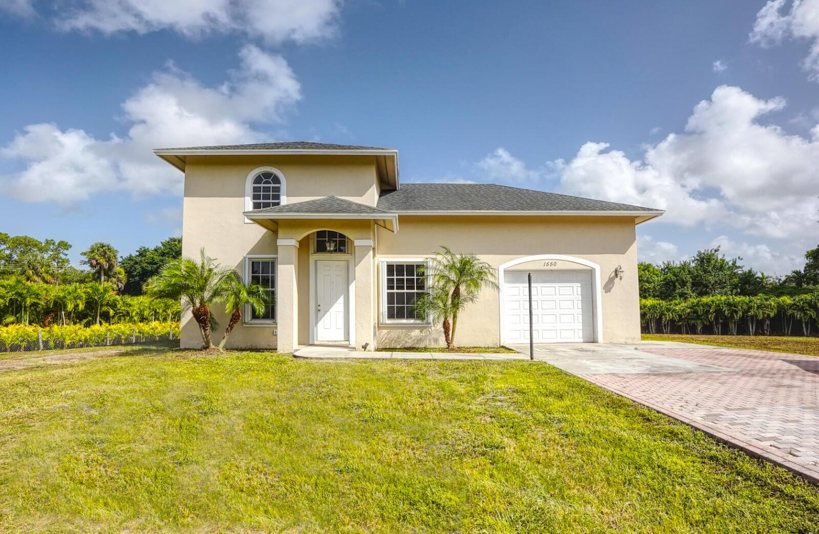 1550 C Road Loxahatchee Groves, FL 33470 - Photo 1 of 23 1550 C Rd front of home