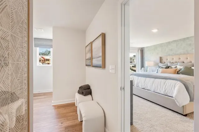 a bed room with a bed couch and a window