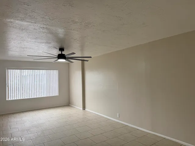 a view of an empty room with windows
