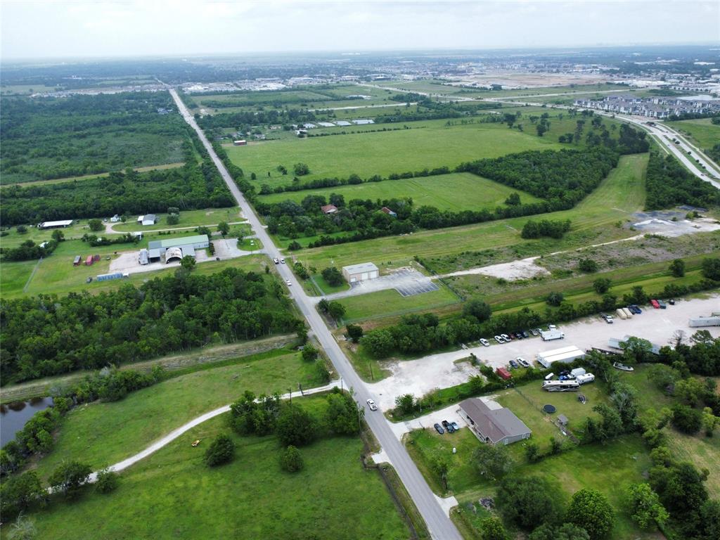 0 John Martin Road Baytown, TX 77521 - Photo 11 of 19 an aerial view of green landscape with trees houses and mountain view