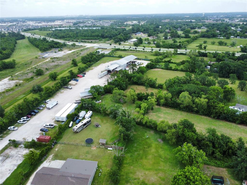 0 John Martin Road Baytown, TX 77521 - Photo 15 of 19 an aerial view of green landscape with trees houses and mountain view
