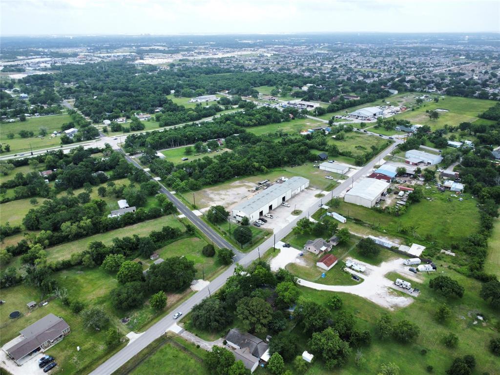 0 John Martin Road Baytown, TX 77521 - Photo 10 of 19 an aerial view of residential houses with outdoor space and trees