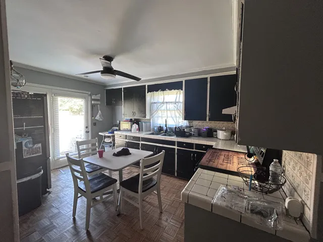a dining room with furniture and window