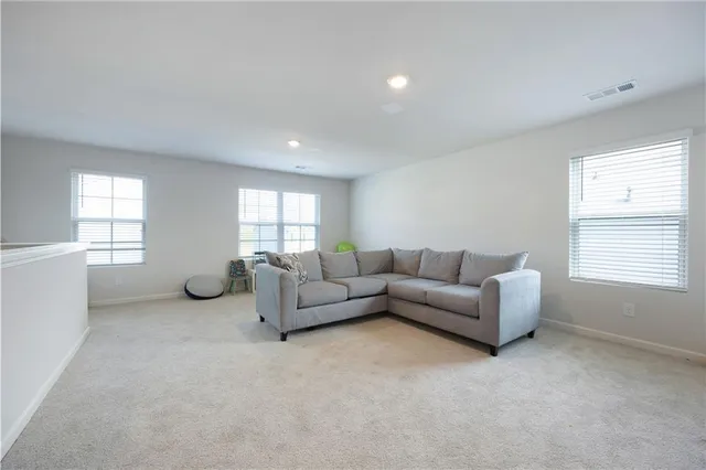 a living room with furniture and window