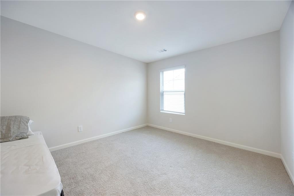 7571 Deerridge Way Fairburn, GA 30213 - Photo 21 of 26 an empty room with a window