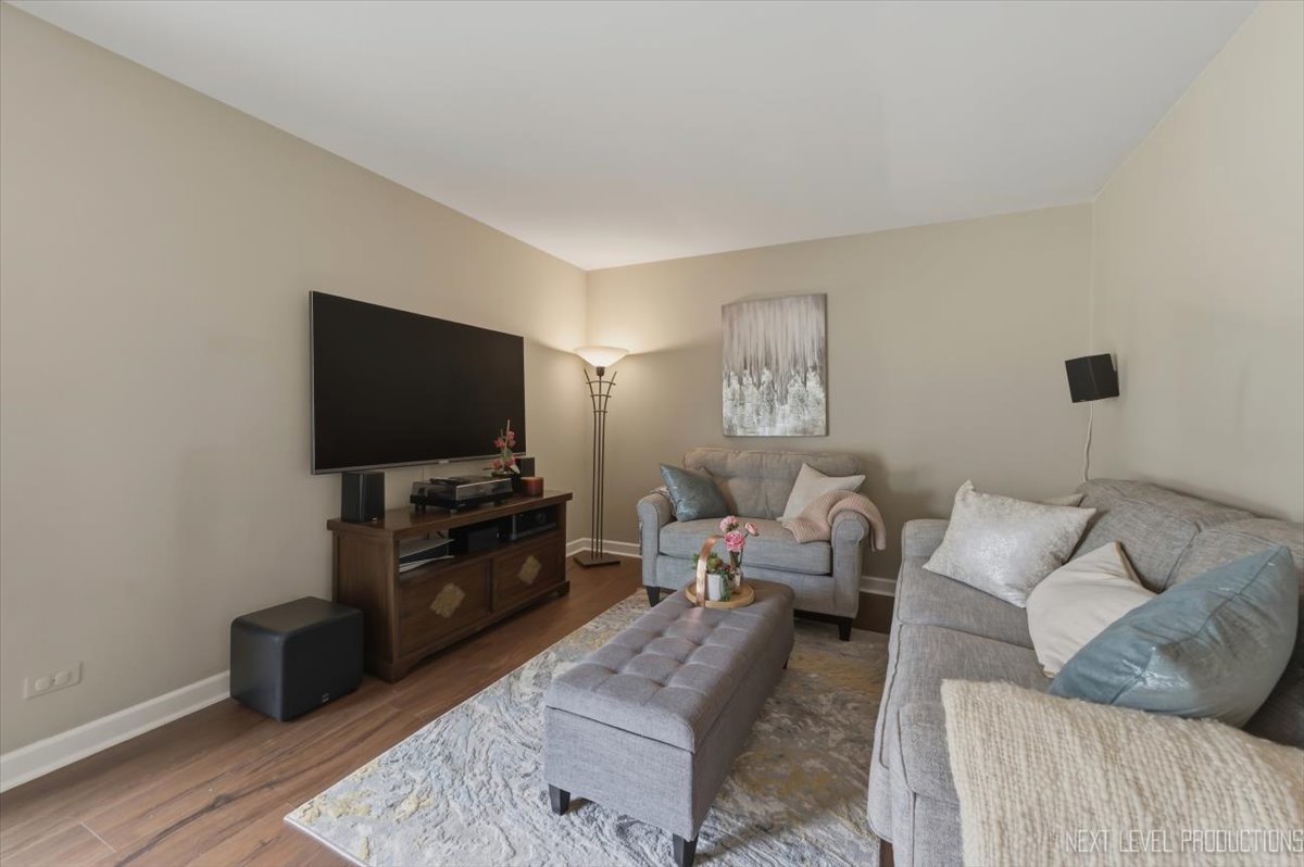 1601 Castbourne Court Wheaton, IL 60189 - Photo 11 of 30 a living room with furniture and a flat screen tv