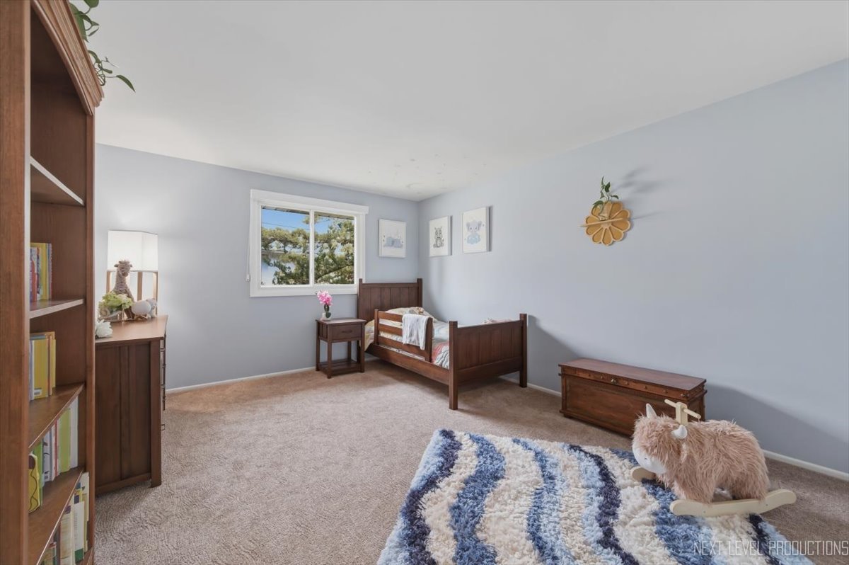 1601 Castbourne Court Wheaton, IL 60189 - Photo 16 of 30 a bedroom with furniture and a window