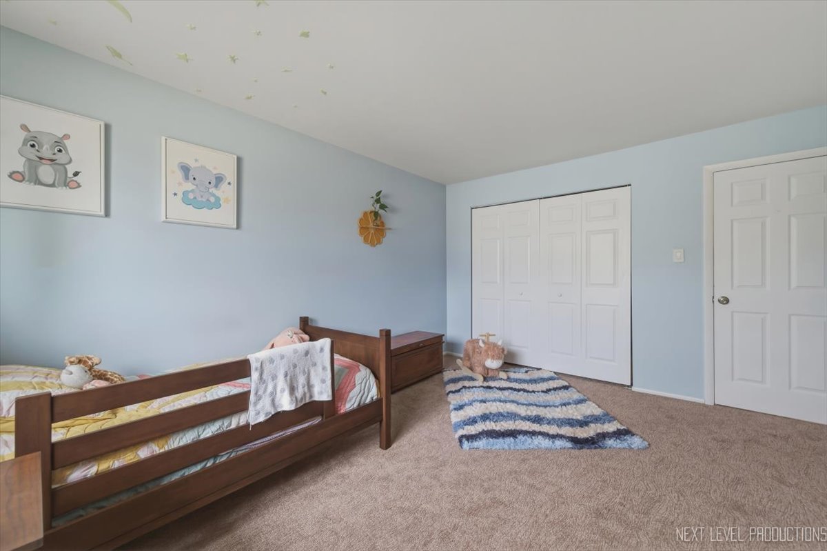 1601 Castbourne Court Wheaton, IL 60189 - Photo 17 of 30 a bedroom with furniture and a window