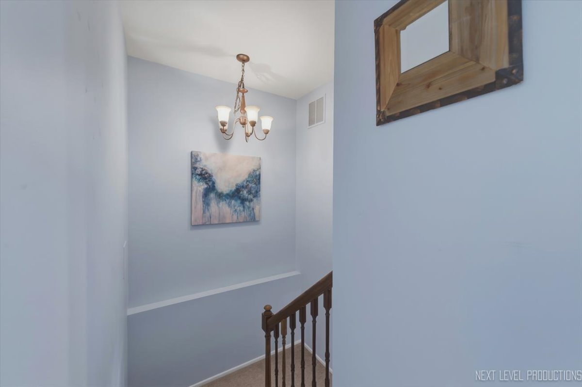 1601 Castbourne Court Wheaton, IL 60189 - Photo 20 of 30 a view of staircase with wooden floor