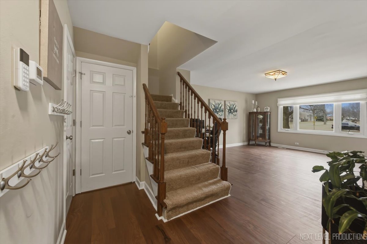 1601 Castbourne Court Wheaton, IL 60189 - Photo 2 of 30 a view of entryway with livingroom and wooden floor