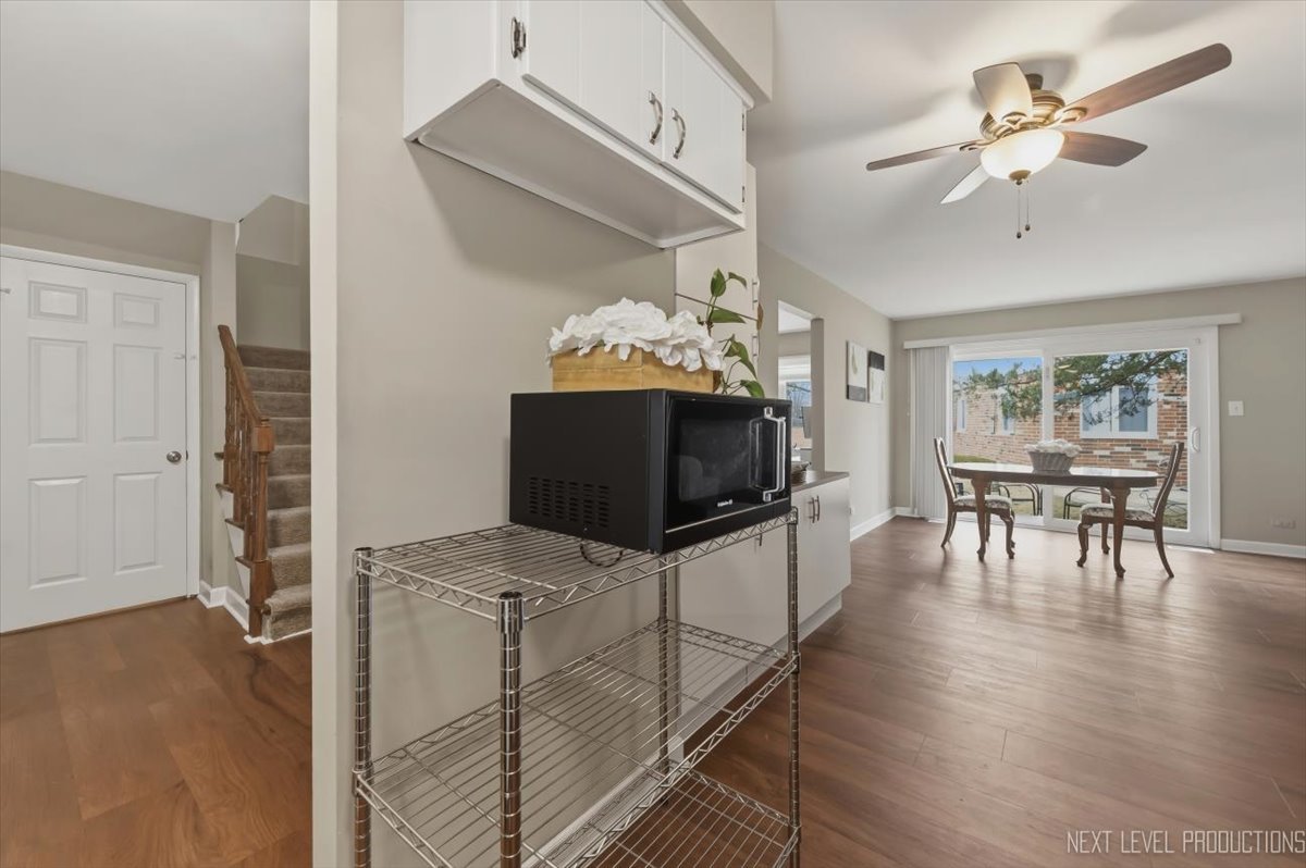 1601 Castbourne Court Wheaton, IL 60189 - Photo 7 of 30 a living room with furniture and a flat screen tv