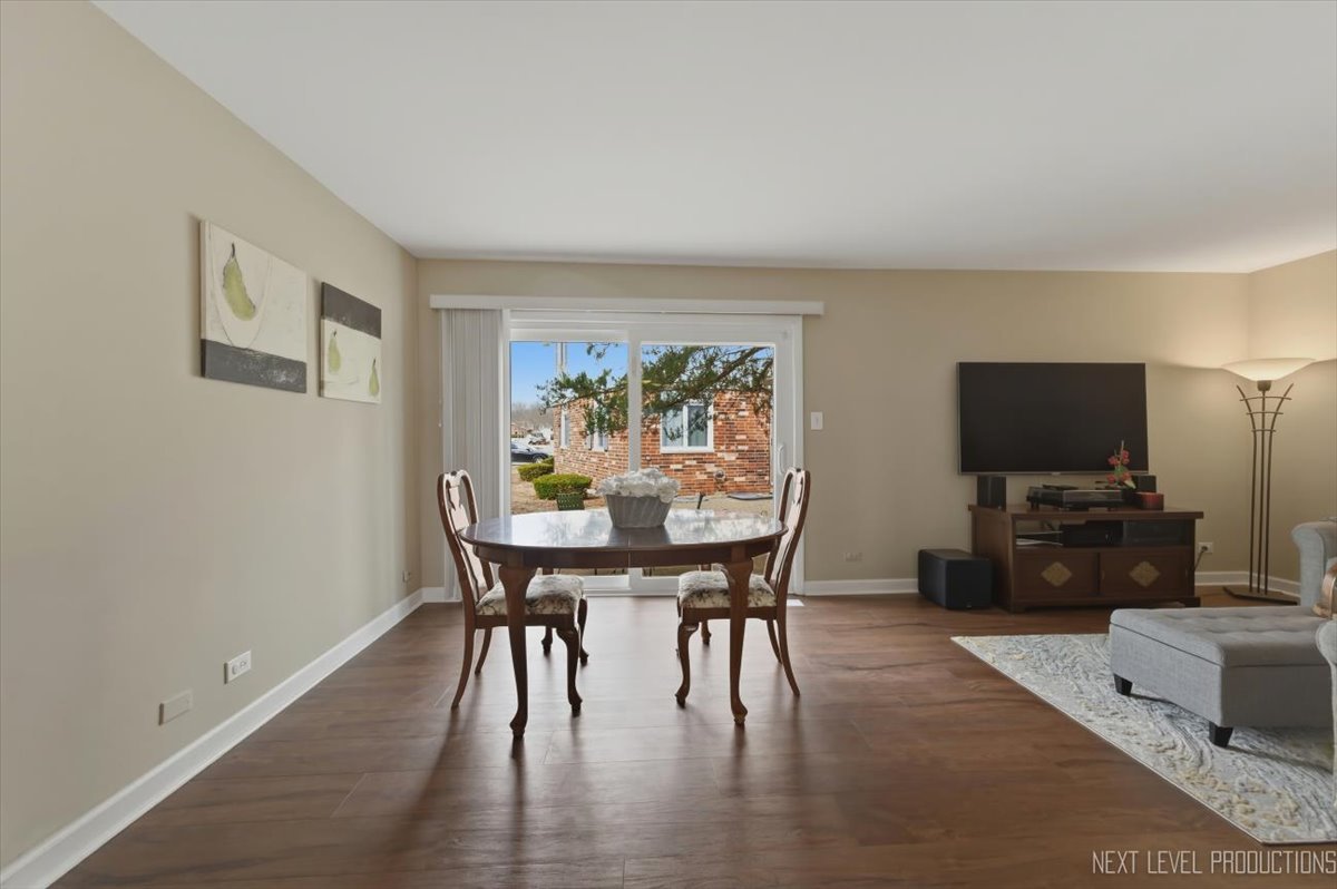 1601 Castbourne Court Wheaton, IL 60189 - Photo 10 of 30 a view of a dining room with furniture window and wooden floor