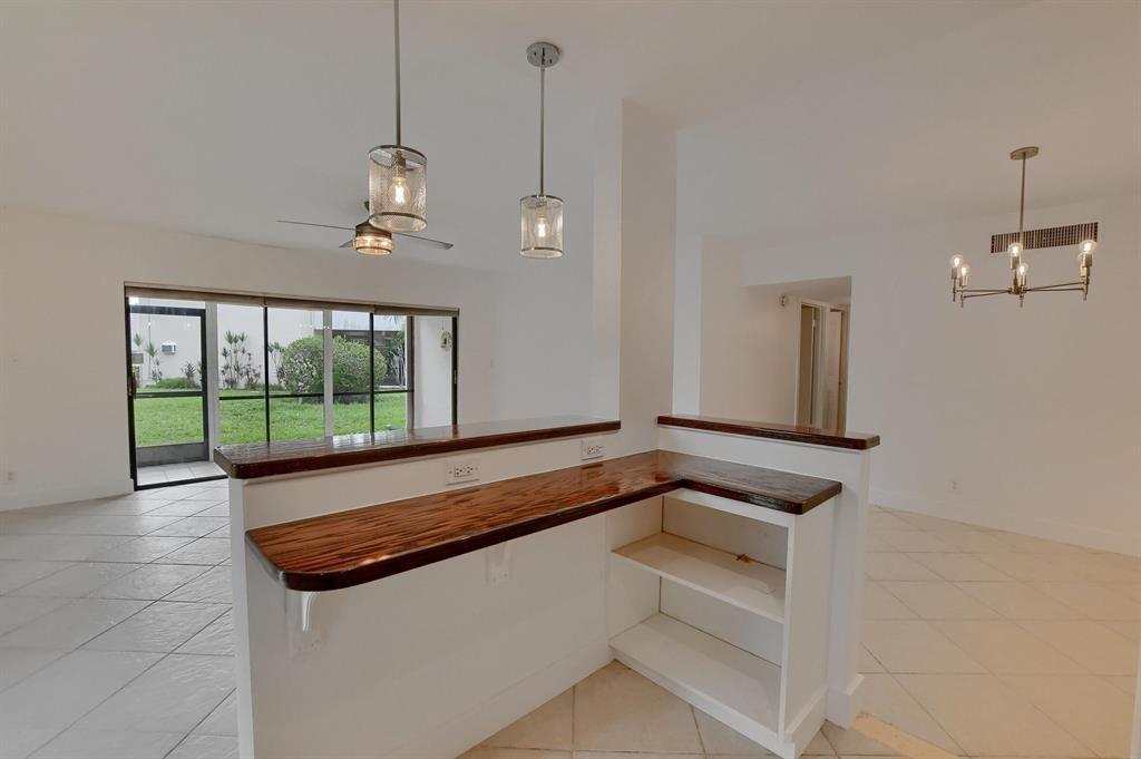 516 Osprey Drive, Unit 14A Delray Beach, FL 33444 - Photo 7 of 20 a view of room with ceiling fan