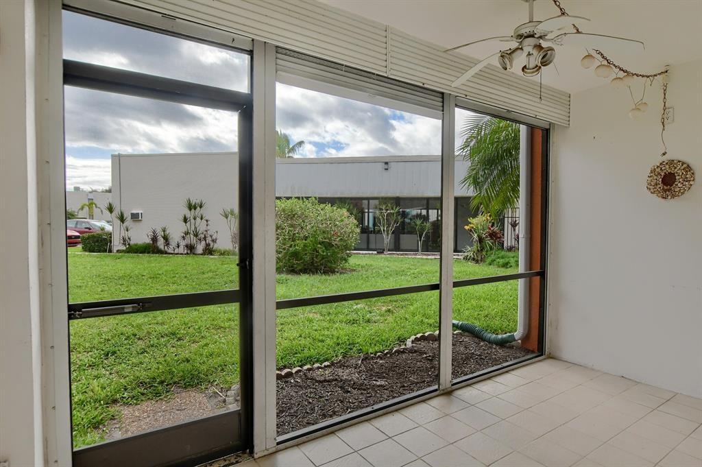 516 Osprey Drive, Unit 14A Delray Beach, FL 33444 - Photo 8 of 20 a view of a house that has a porch