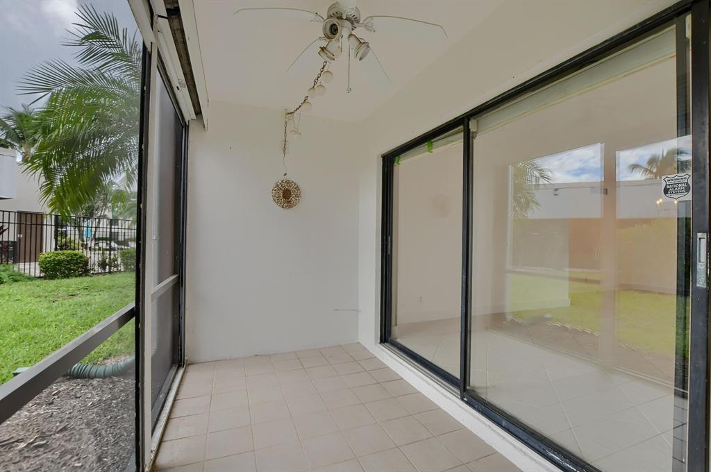 516 Osprey Drive, Unit 14A Delray Beach, FL 33444 - Photo 9 of 20 a view of a bathroom with a shower