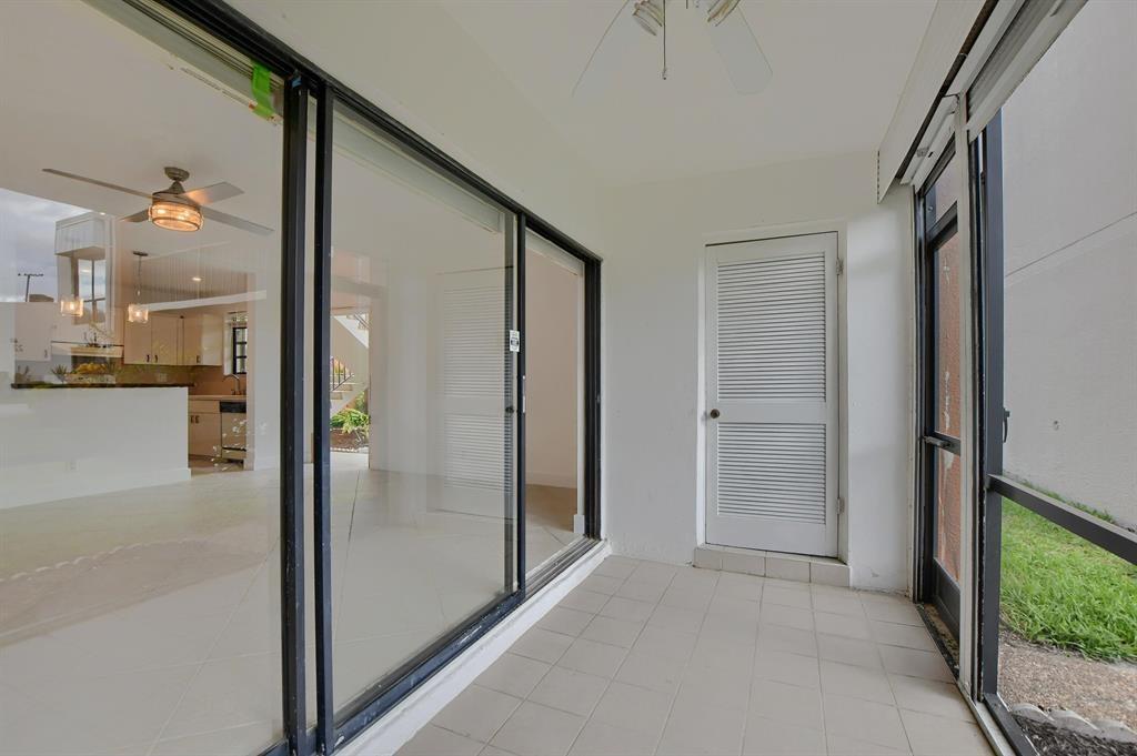 516 Osprey Drive, Unit 14A Delray Beach, FL 33444 - Photo 10 of 20 wooden floor in an empty room