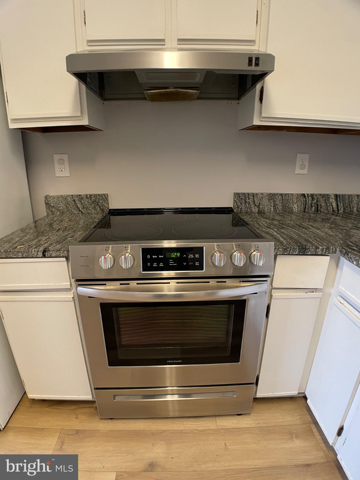 1401 Key Parkway, Unit 204 Frederick, MD 21702 - Photo 16 of 25 a stove top oven sitting inside of a kitchen
