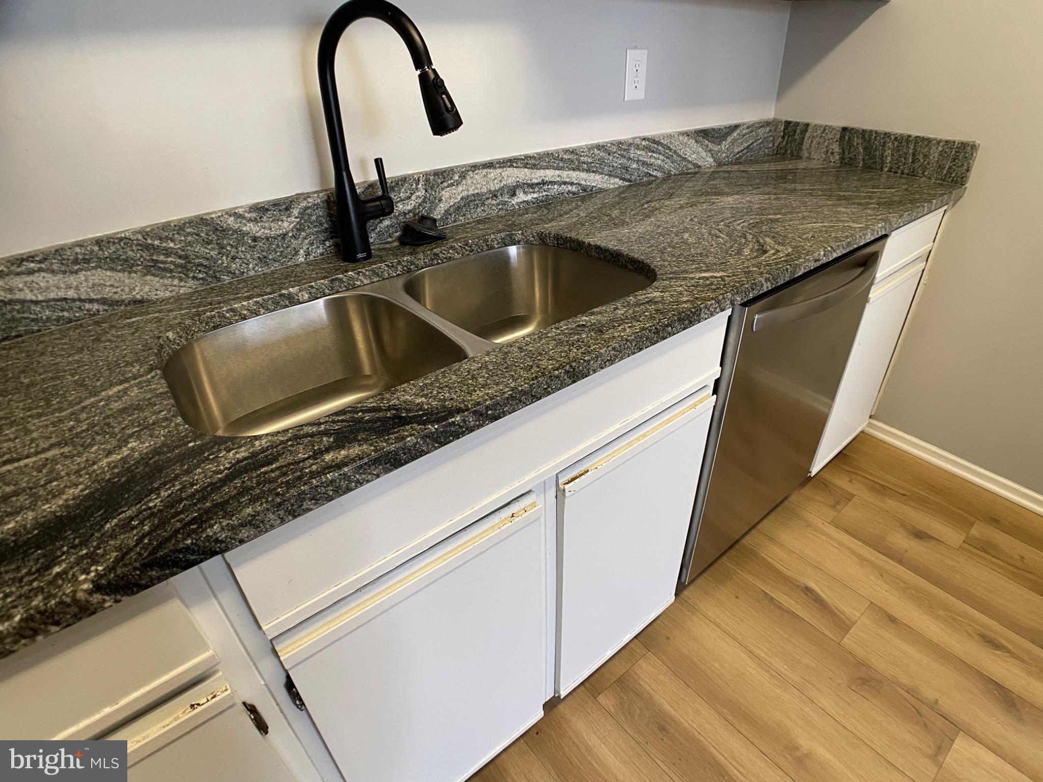 1401 Key Parkway, Unit 204 Frederick, MD 21702 - Photo 24 of 25 a close view of a sink and dishwasher