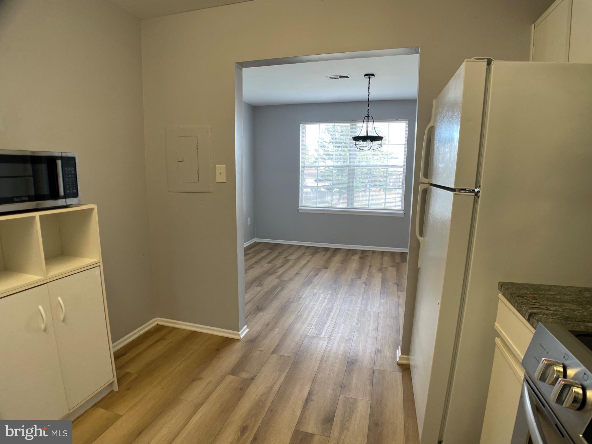 1401 Key Parkway, Unit 204 Frederick, MD 21702 - Photo 4 of 25 a view of a kitchen from a hallway