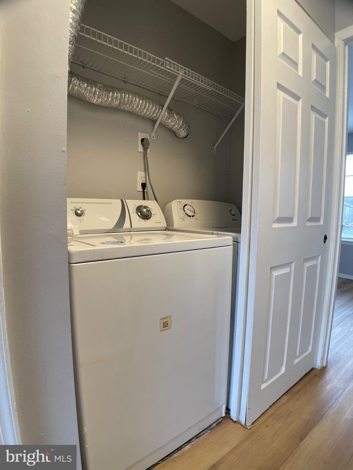 1401 Key Parkway, Unit 204 Frederick, MD 21702 - Photo 8 of 25 a utility room with dryer and washer