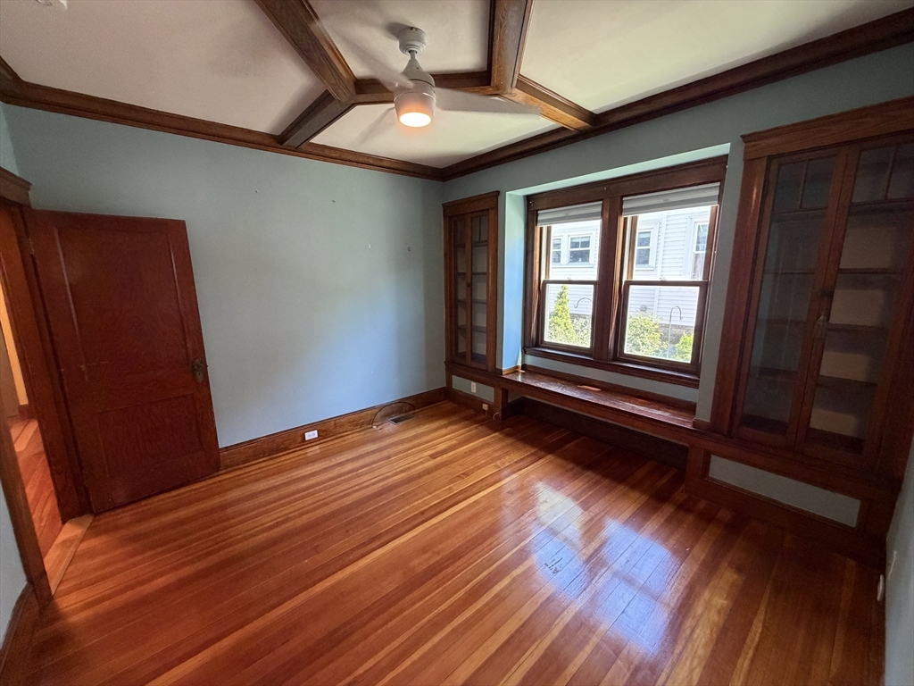 12-14 Warwick Road, Unit 12 Belmont, MA 02478 - Photo 11 of 15 a view of empty room with wooden floor and fan