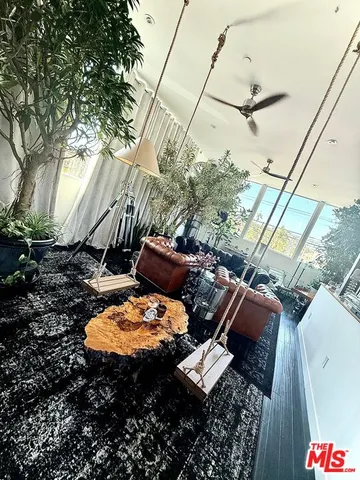 a backyard of a house with outdoor seating