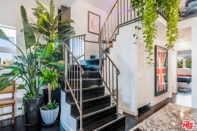 a view of entryway with flower pots