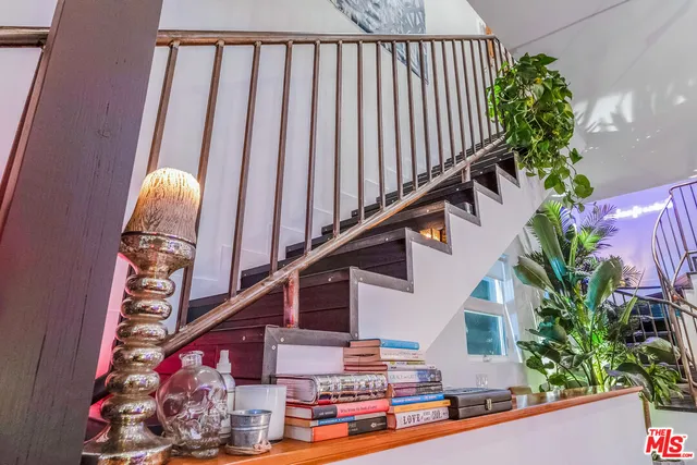 a view of a chairs and table in a backyard