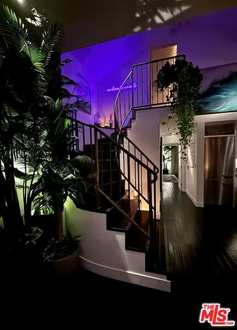 a lobby with furniture and a potted plant