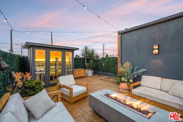 a outdoor living space with furniture and a potted plant