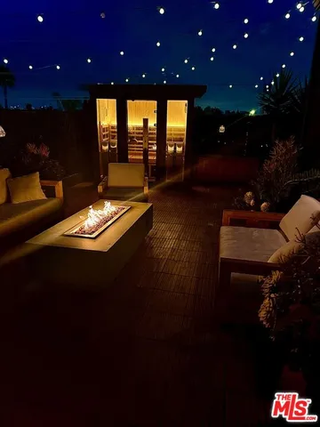 a view of swimming pool with outdoor seating