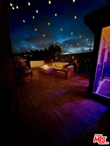 a view of a couches and a tables in the patio