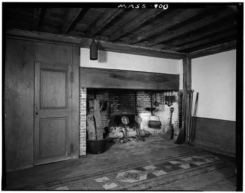 3 Bear Street Nantucket, MA 02554 - Photo 9 of 38 a view of empty room with wooden floor and fireplace