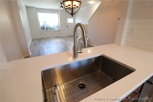 a close view of a sink a washer and dryer