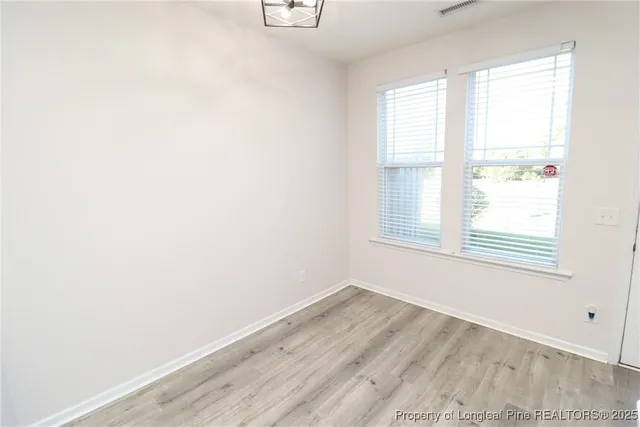 a kitchen with stainless steel appliances a refrigerator and a stove top oven