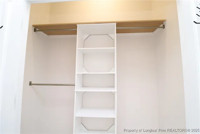 a bathroom with a sink mirror and vanity