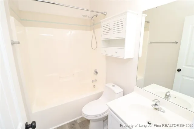 a view of a bathroom with sink and shower