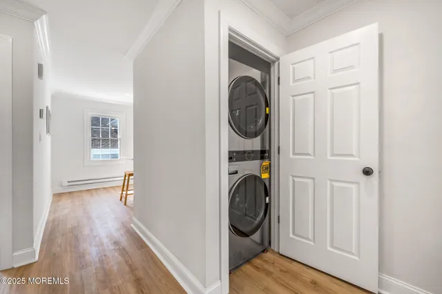 a view of a hallway with washer and dryer
