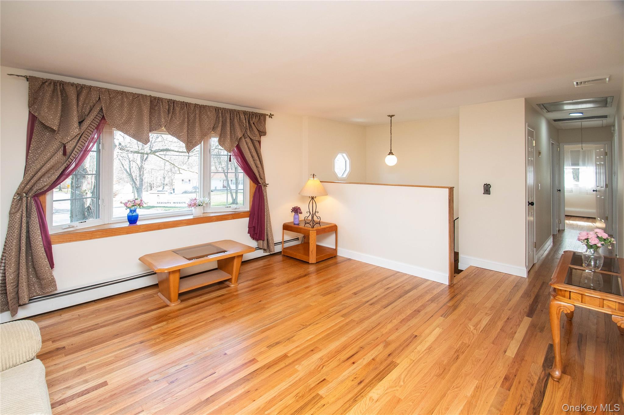 24 Montfort Road Wappingers Falls, NY 12590 - Photo 11 of 45 an empty room with wooden floor and windows