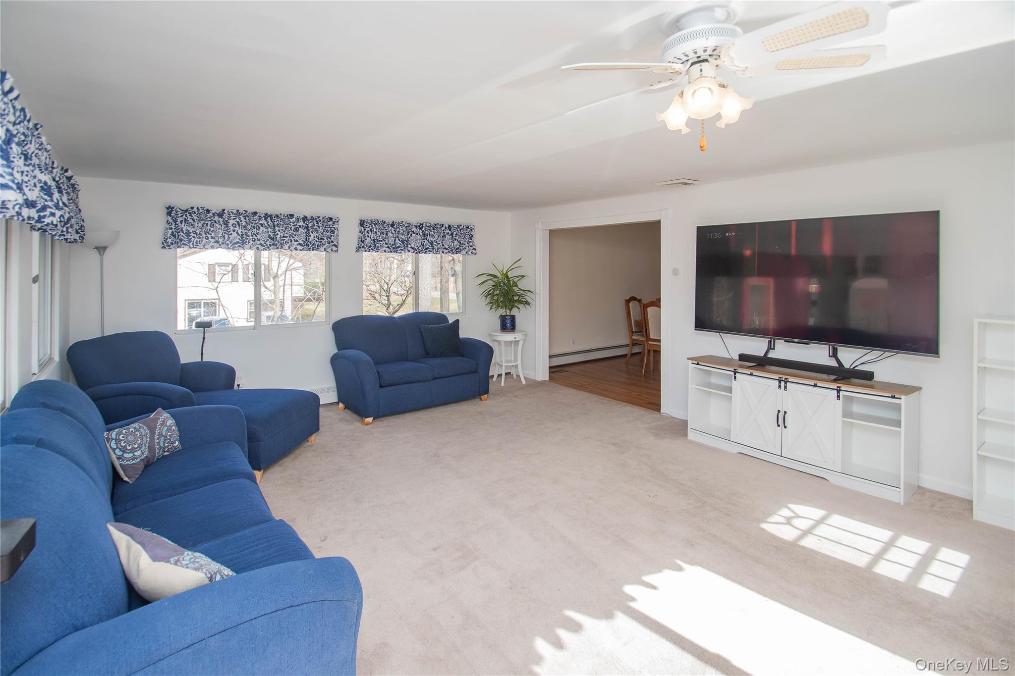 24 Montfort Road Wappingers Falls, NY 12590 - Photo 15 of 45 a living room with furniture and a flat screen tv
