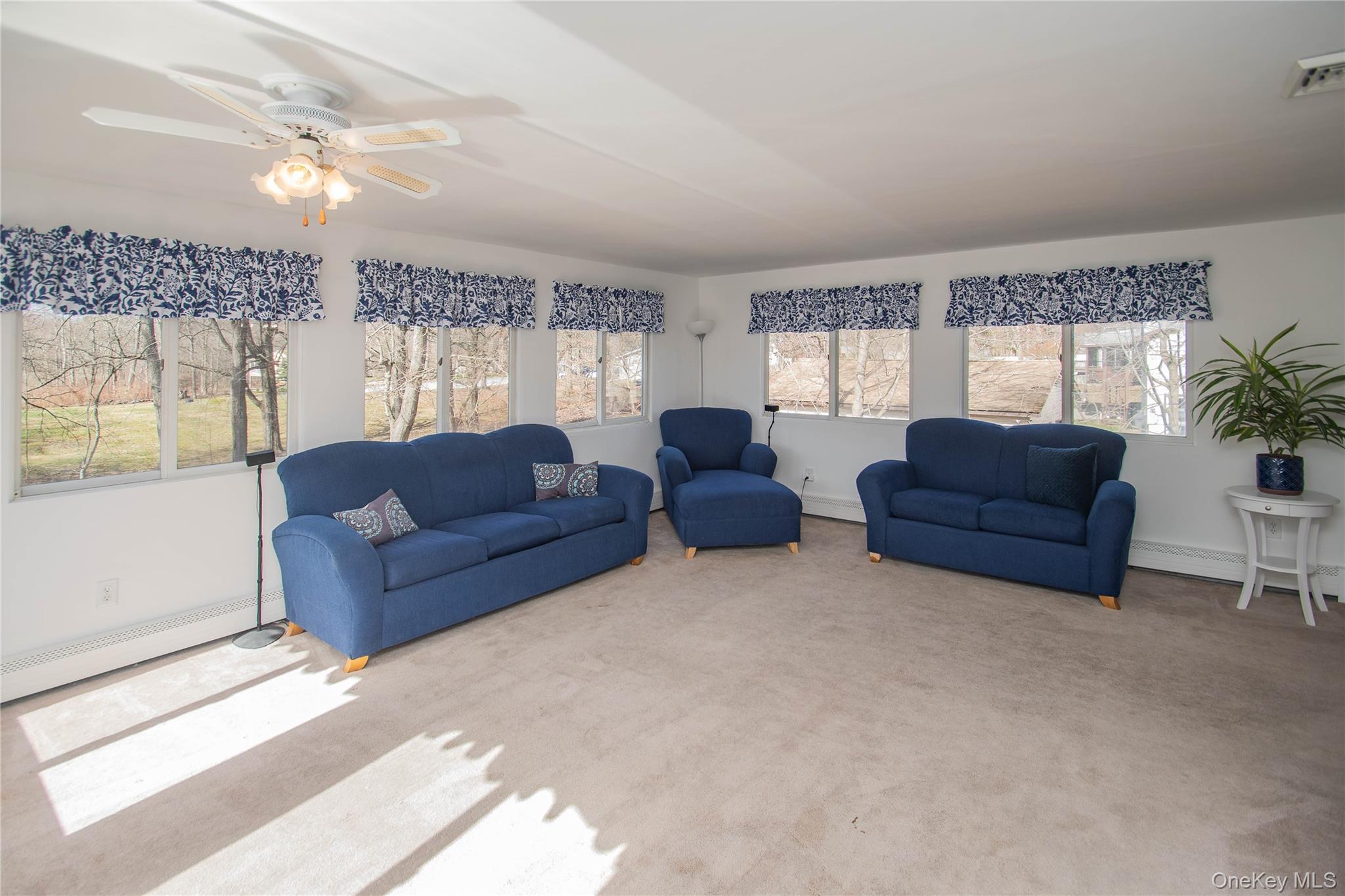 24 Montfort Road Wappingers Falls, NY 12590 - Photo 16 of 45 a living room with couches and a large window with balcony view