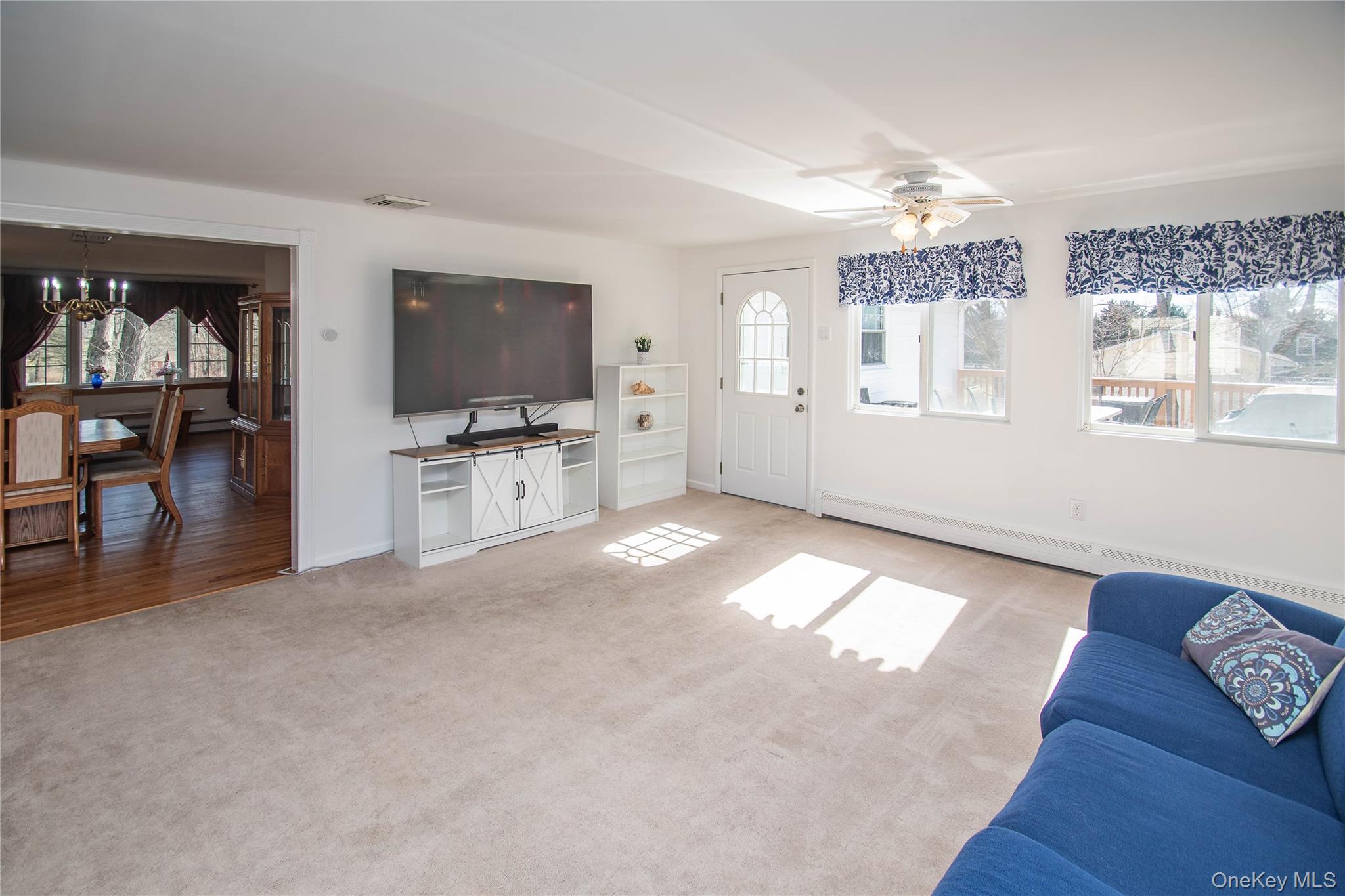 24 Montfort Road Wappingers Falls, NY 12590 - Photo 17 of 45 a living room with furniture and a flat screen tv
